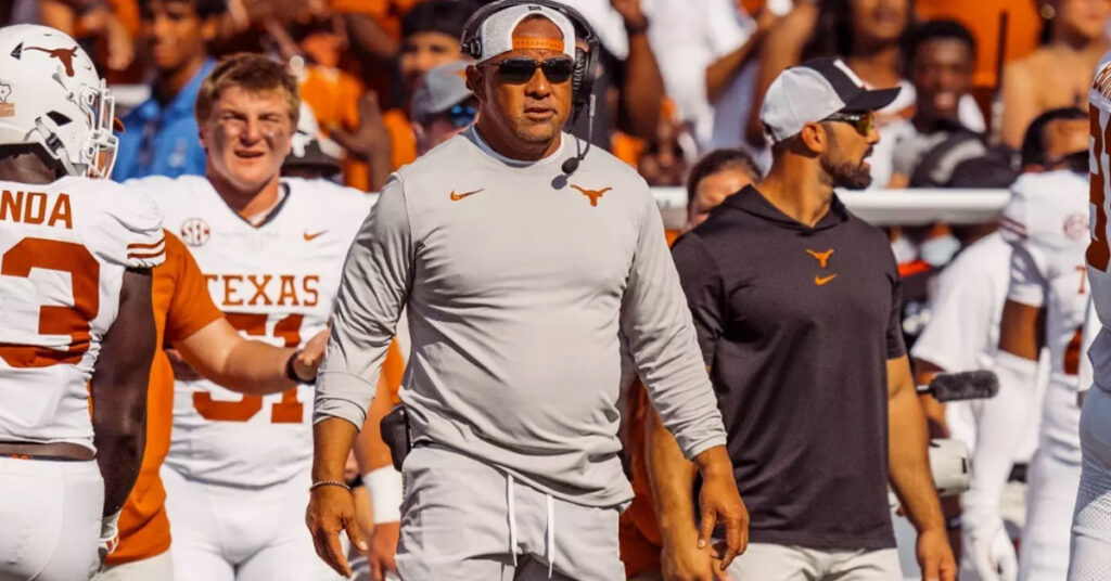 Coach Johnny Nansen on the Texas Longhorns sideline during a college football game