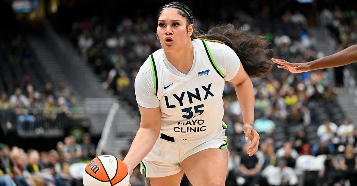 Alissa Pili playing for Minnesota Lynx, driving toward the basket during a WNBA game