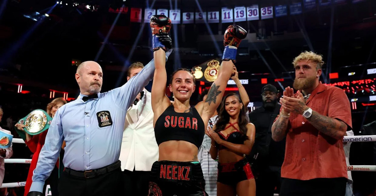 Cherneka “Sugar Neekz” Johnson celebrates her undisputed bantamweight boxing victory at Madison Square Garden with referee raising her arm.