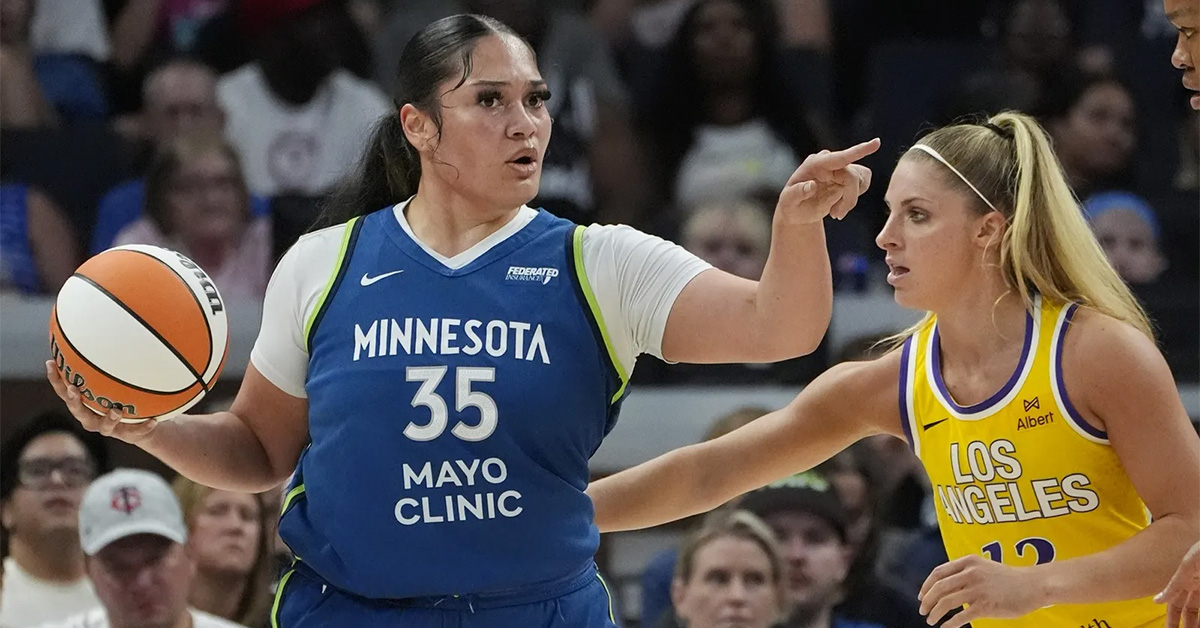 Alissa Pili of the Minnesota Lynx drives against LA Sparks defender Sarah Ashlee Barker during a WNBA game at Target Center on June 21, 2025