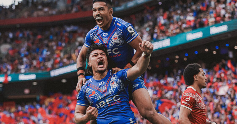 Two Toa Samoa rugby league players celebrating a try against Tonga XIII at Suncorp Stadium, showcasing Pacific pride and intensity during the 2025 Pacific Championships.