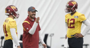 New Stanford head coach Tavita Pritchard instructing Washington Commanders quarterbacks Sam Howell and Jacoby Brissett during NFL practice.