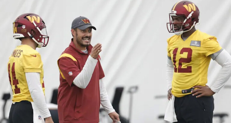 New Stanford head coach Tavita Pritchard instructing Washington Commanders quarterbacks Sam Howell and Jacoby Brissett during NFL practice.