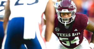 xas A&M linebacker Jordan Lockhart (54) in a defensive stance during a college football game