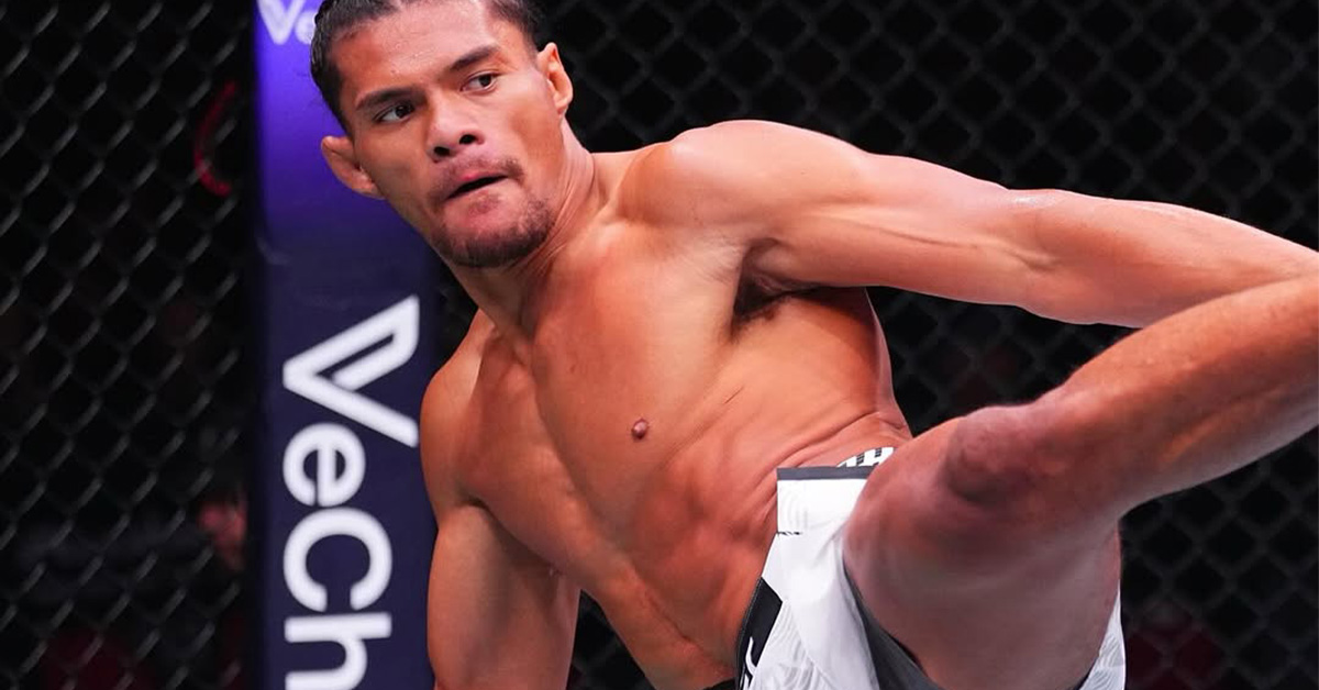 UFC fighter Billy Elekana throwing a powerful strike during his submission victory against Junior Tafa at UFC 325 in Sydney, Australia