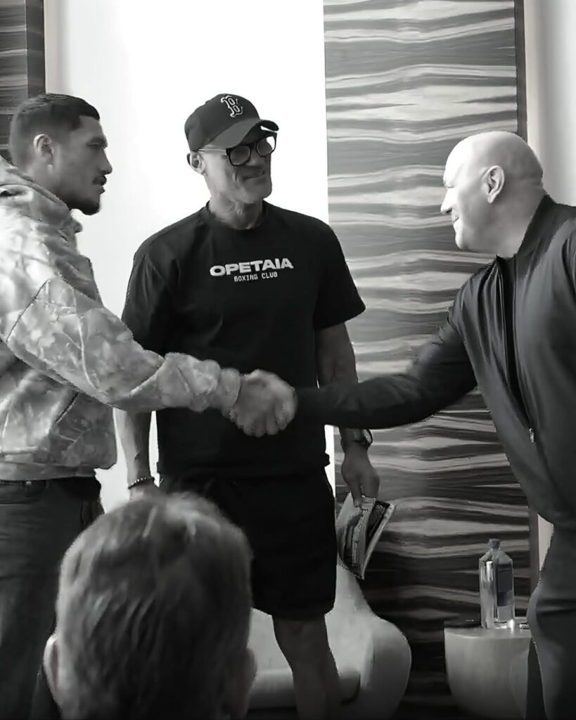 Jai Opetaia shaking hands with Dana White and Tapu Opetaia during Zuffa Boxing signing ceremony.