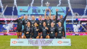 The New Zealand Black Ferns Sevens team celebrating with the trophy and gold medals after winning the HSBC SVNS New York championship.