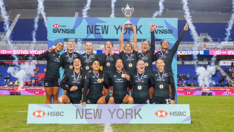 The New Zealand Black Ferns Sevens team celebrating with the trophy and gold medals after winning the HSBC SVNS New York championship.