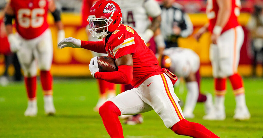 Wide receiver JuJu Smith-Schuster secures a football during an NFL game with the Kansas City Chiefs before signing with the New York Giants.