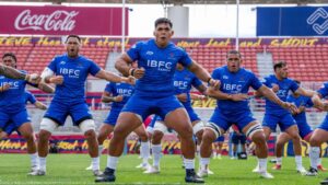 Samoa national rugby team performs the traditional Siva Tau before an international rugby match, showcasing Samoan culture and team unity.