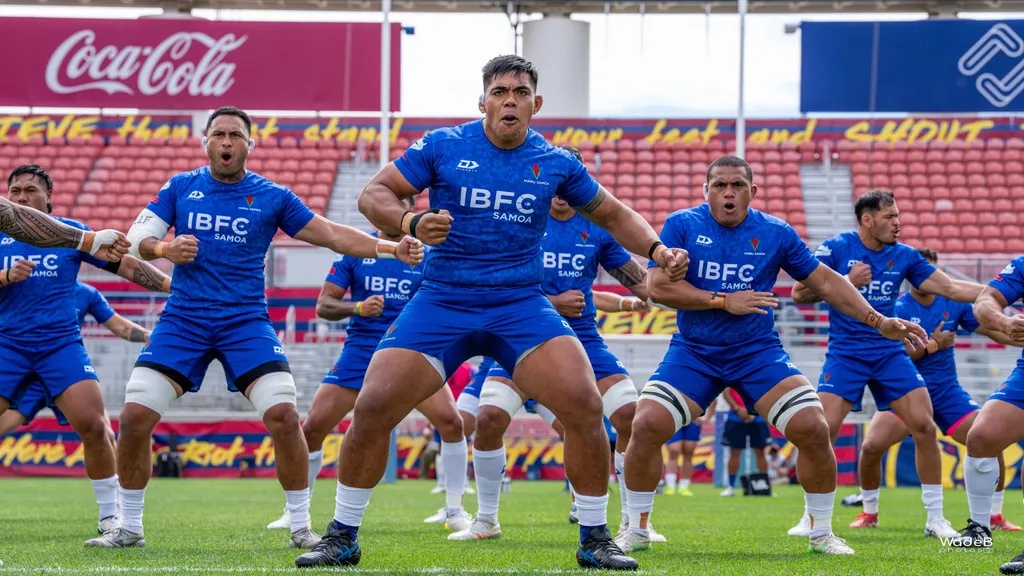 Samoa national rugby team performs the traditional Siva Tau before an international rugby match, showcasing Samoan culture and team unity.