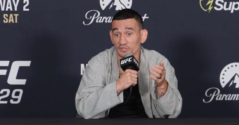 Max Holloway speaks into a UFC microphone at UFC 329 media day ahead of his welterweight rematch with Conor McGregor