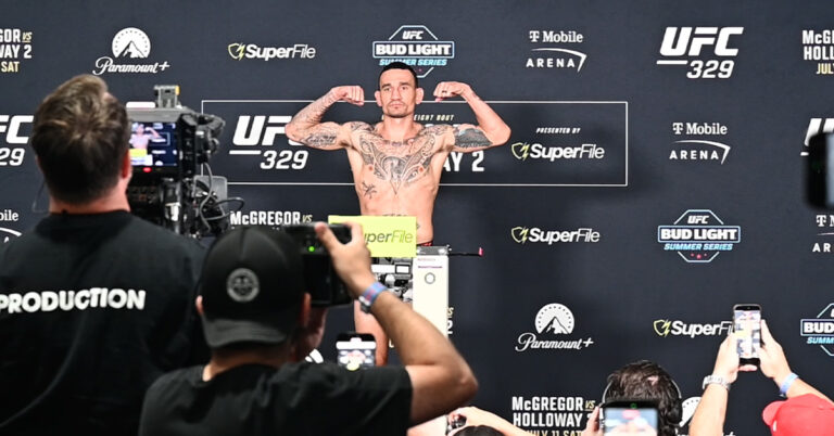 Max Holloway flexes on the scale at UFC 329 weigh-ins, hitting 170 pounds for his welterweight main event vs Conor McGregor