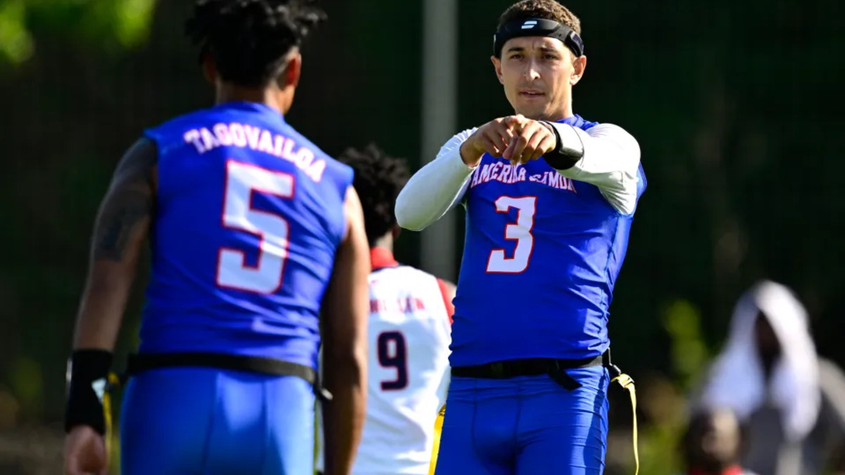 American Samoa flag football players Tauelia Tangivailoa and teammate celebrate during their historic 38–32 win over the United States.