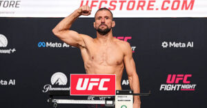 Mateusz Gamrot flexes on the scale at the UFC Fight Night: Gamrot vs. Salkilld official weigh-in