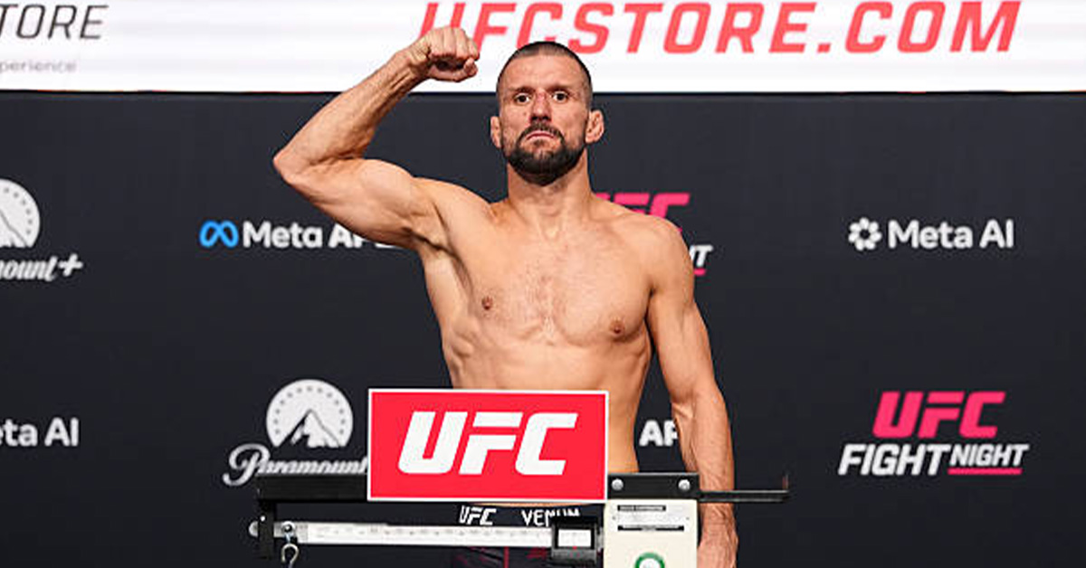 Mateusz Gamrot flexes on the scale at the UFC Fight Night: Gamrot vs. Salkilld official weigh-in