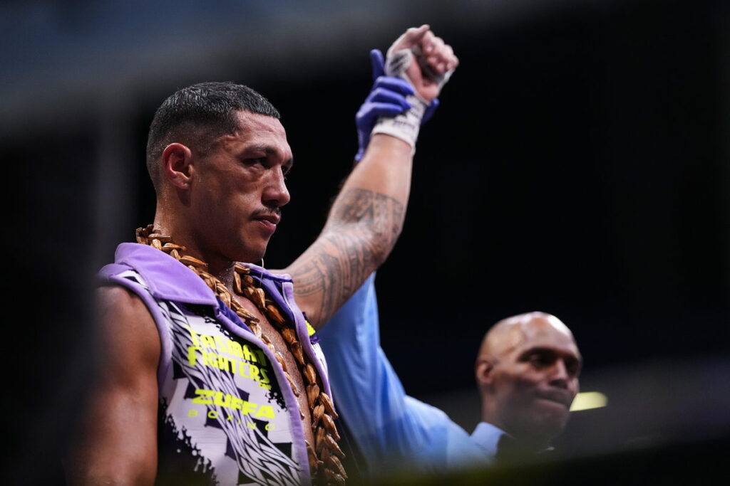 Jai Opetaia has his hand raised after stopping Noel Mikaelian to move to 31-0