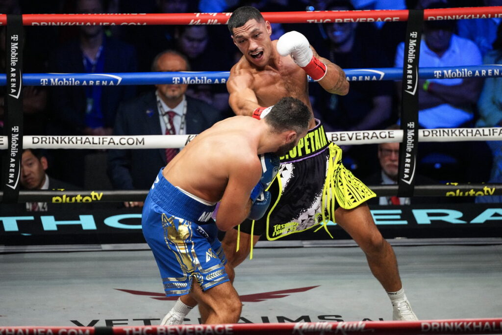 Jai Opetaia works inside as Noel Mikaelian covers up against the ropes in Las Vegas