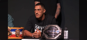 Cruiserweight champion Jai Opetaia at the Las Vegas press conference table beside his Zuffa Boxing championship belt