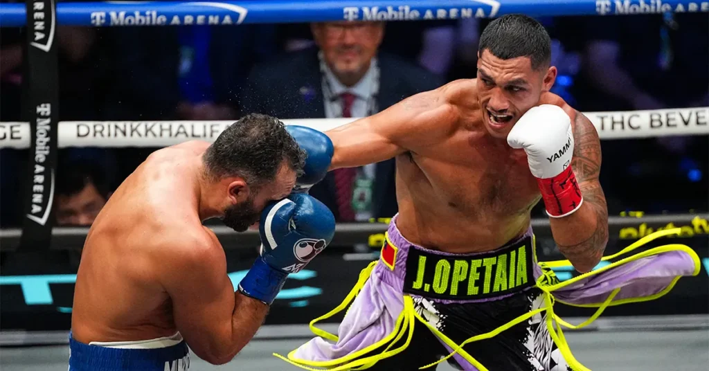 Samoan-Australian cruiserweight champion Jai Opetaia lands a right hand on Noel Mikaelian during their title fight at T-Mobile Arena
