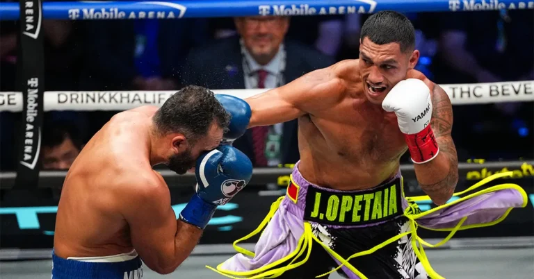 Samoan-Australian cruiserweight champion Jai Opetaia lands a right hand on Noel Mikaelian during their title fight at T-Mobile Arena